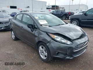 2019 Ford Fiesta SE z VIN 3FADP4BJXKM102440, wystawiony jako IAAI lot #42187653 z przebiegiem 76 771 mil mil oraz . Historia ofert i sprzedaży dostępna na DreamBid. Obrazek 1.