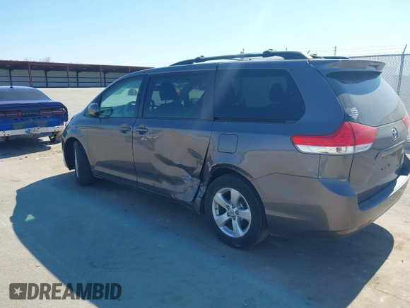 2012 Toyota Sienna LE AAS with VIN 5TDKK3DC8CS269924, listed as a IAAI auction lot 41764722 with 176,968 mi miles. Bid and sale history available at carsss.com. Image 3.