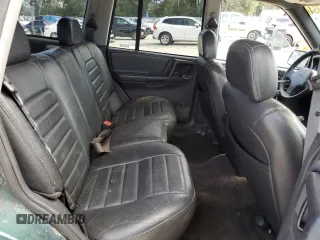 1996 Jeep Grand Cherokee Laredo with VIN 1J4GZ58S1TC340018, listed as a Copart auction lot 86571454 with 0 mi miles and Salvage Title. Bid and sale history available at carsss.com. Image 11.