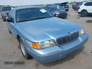 2000 Mercury Grand Marquis LS z VIN 2MEFM75W1YX673105, wystawiony jako IAAI lot #42050980 z przebiegiem 154 944 mil mil oraz . Historia ofert i sprzedaży dostępna na DreamBid. Obrazek 1.
