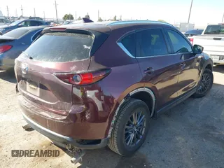 2019 Mazda CX-5 Sport with VIN JM3KFABM2K0686372, listed as a IAAI auction lot 41770183 with 57,202 mi miles and . Bid and sale history available at DreamBid. Image 4.