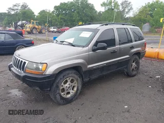 1999 Jeep Grand Cherokee Laredo with VIN 1J4G258SXXC518647, listed as a IAAI auction lot 42124724 with 229,668 mi miles and . Bid and sale history available at DreamBid. Image 2.