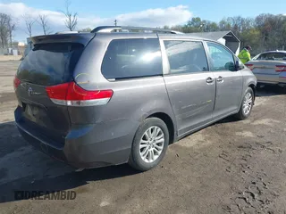 2014 Toyota Sienna XLE with VIN 5TDYK3DC5ES475750, listed as a IAAI auction lot 41976805 with 221,804 mi miles. Bid and sale history available at carsss.com. Image 4.