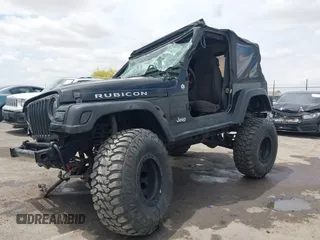 2004 Jeep Wrangler Rubicon z VIN 1J4FA69S84P727716, wystawiony jako IAAI lot #42162129 z przebiegiem 90 844 mil mil oraz . Historia ofert i sprzedaży dostępna na DreamBid. Obrazek 18.