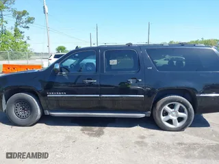 2011 Chevrolet Suburban LTZ with VIN 1GNSCKE01BR275919, listed as a IAAI auction lot 42038399 with 247,841 mi miles. Bid and sale history available at carsss.com. Image 14.