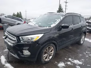 2017 Ford Escape SE with VIN 1FMCU0GD5HUD08968, listed as a IAAI auction lot 42008576 with 95,363 mi miles and . Bid and sale history available at DreamBid. Image 2.
