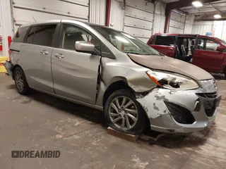2012 Mazda 5 Sport z VIN JM1CW2BL1C0115371, wystawiony jako IAAI lot #42134834 z przebiegiem 138 840 mil mil oraz . Historia ofert i sprzedaży dostępna na DreamBid. Obrazek 1.
