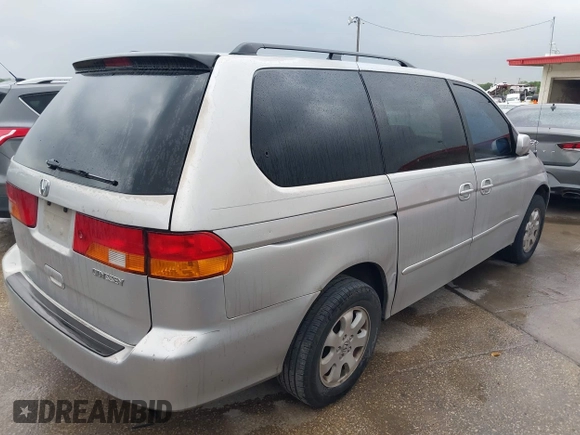 2004 Honda Odyssey EX with VIN 5FNRL18694B076305, listed as a IAAI auction lot 41929212 with 287,717 mi miles and . Bid and sale history available at DreamBid. Image 4.