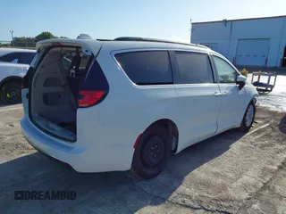2022 Chrysler Pacifica Touring L with VIN 2C4RC1BGXNR233654, listed as a IAAI auction lot 42137632 with 73,899 mi miles and . Bid and sale history available at DreamBid. Image 4.