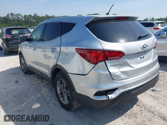 2018 Hyundai Santa Fe 2.4L z VIN 5XYZTDLB9JG513584, wystawiony jako IAAI lot #42031291 z przebiegiem 131 109 mil mil oraz . Historia ofert i sprzedaży dostępna na DreamBid. Obrazek 3.