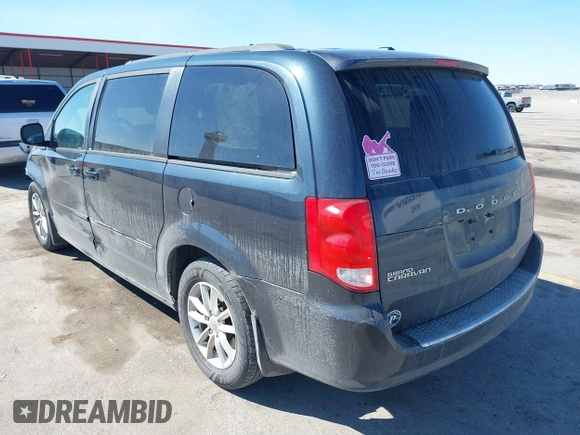 2014 Dodge Grand Caravan SXT with VIN 2C4RDGCG1ER167624, listed as a IAAI auction lot 41888822 with 202,729 mi miles and . Bid and sale history available at DreamBid. Image 3.