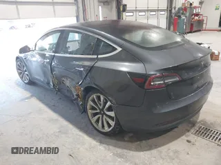 2018 Tesla Model 3 Long Range Battery with VIN 5YJ3E1EB1JF145520, listed as a IAAI auction lot 41360939 with 95,010 mi miles and . Bid and sale history available at DreamBid. Image 3.
