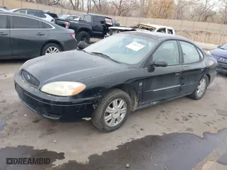 2004 Ford Taurus SEL with VIN 1FAHP56S44A129658, listed as a IAAI auction lot 41381122 with 298,335 mi miles. Bid and sale history available at carsss.com. Image 2.
