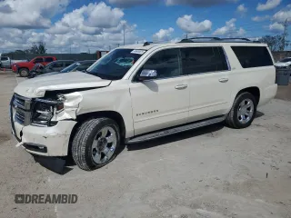 2015 Chevrolet Suburban LTZ with VIN 1GNSKKKC0FR130023, listed as a Copart auction lot 46630825 with 140,057 mi miles and Salvage Title. Bid and sale history available at carsss.com. Image 1.