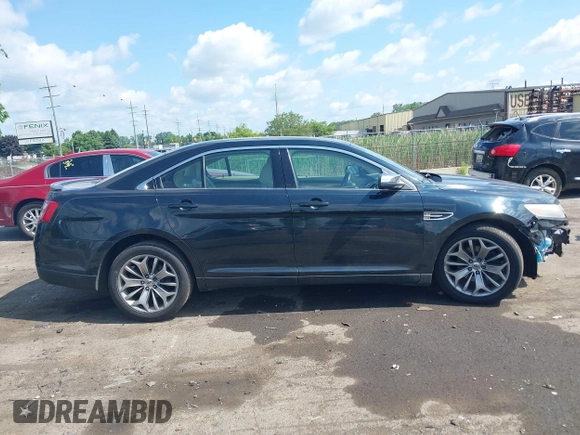 2014 Ford Taurus Limited z VIN 1FAHP2F85EG125118, wystawiony jako IAAI lot #42457437 z przebiegiem 129 406 mil mil oraz . Historia ofert i sprzedaży dostępna na DreamBid. Obrazek 13.