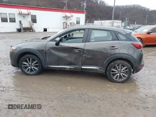 2016 Mazda CX-3 Grand Touring with VIN JM1DKBD77G0107328, listed as a IAAI auction lot 41682949 with 156,935 mi miles. Bid and sale history available at carsss.com. Image 14.