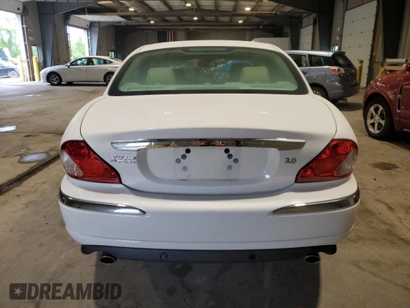 2004 Jaguar X-Type with VIN SAJEA51C34WE06046, listed as a Copart auction lot 56982105 with 69,265 mi miles and Clean Title. Bid and sale history available at DreamBid. Image 6.