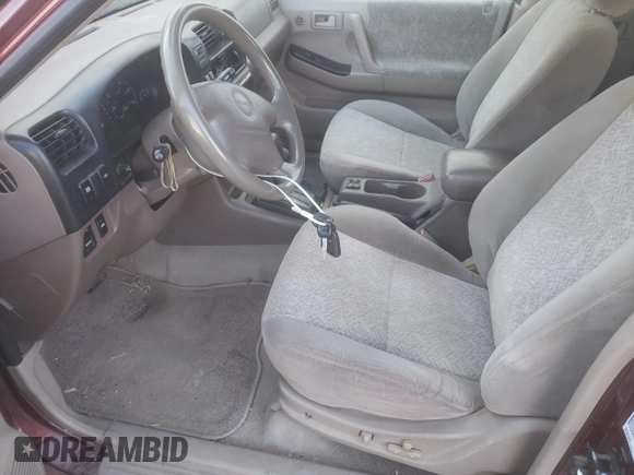2002 Isuzu Rodeo S with VIN 4S2DM58W824313096, listed as a Copart auction lot 77951364 with 127,470 mi miles and Salvage Title. Bid and sale history available at DreamBid. Image 7.