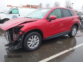 2015 Mazda CX-5 Touring with VIN JM3KE4CY3F0529669, listed as a IAAI auction lot 41866873 with 137,635 mi miles and . Bid and sale history available at carsss.com. Image 2.