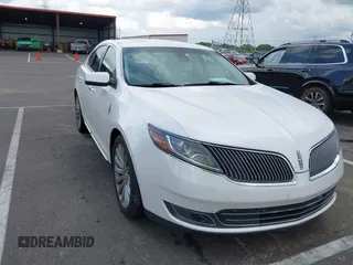 2014 Lincoln MKS z VIN 1LNHL9DK0EG604524, wystawiony jako IAAI lot #42635826 z przebiegiem 124 983 mil mil oraz . Historia ofert i sprzedaży dostępna na DreamBid. Obrazek 1.