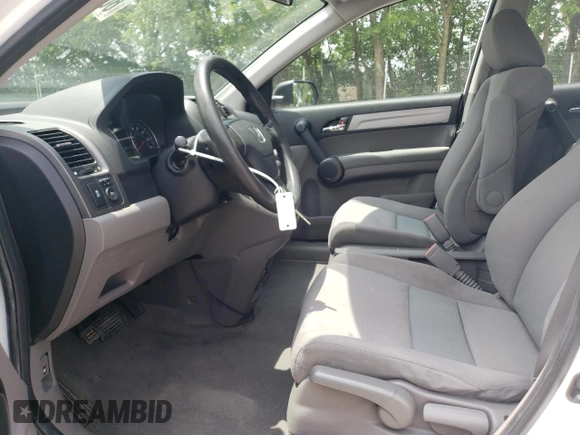 2010 Honda CR-V LX with VIN 3CZRE3H35AG705585, listed as a Copart auction lot 60032855 with 115,136 mi miles and Salvage title. Bid and sale history available at DreamBid. Image 7.