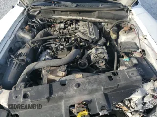 1997 Ford Mustang with VIN 1FALP4044VF174876, listed as a Copart auction lot 41601355 with 103,828 mi miles and Salvage Title. Bid and sale history available at carsss.com. Image 11.