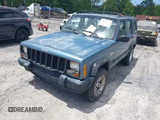 1998 Jeep Cherokee Sport with VIN 1J4FT68S6WL272337, listed as a IAAI auction lot 42147195 with 302,764 mi miles. Bid and sale history available at carsss.com. Image 2.