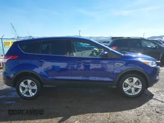 2014 Ford Escape SE with VIN 1FMCU9G99EUD02098, listed as a IAAI auction lot 41814969 with 210,218 mi miles and . Bid and sale history available at DreamBid. Image 14.