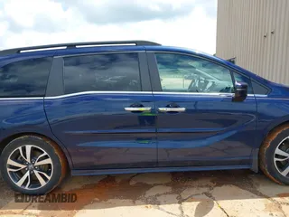 2022 Honda Odyssey Touring with VIN 5FNRL6H86NB004865, listed as a IAAI auction lot 42254009 with 47,229 mi miles and . Bid and sale history available at DreamBid. Image 13.