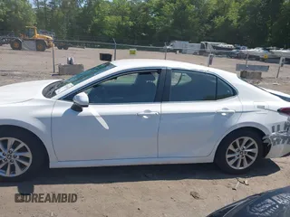 2023 Toyota Camry LE z VIN 4T1C11AK0PU145781, wystawiony jako IAAI lot #42404456 z przebiegiem 53 657 mil mil oraz . Historia ofert i sprzedaży dostępna na DreamBid. Obrazek 14.