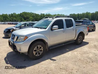 2014 Nissan Frontier SV with VIN 1N6AD0EV9EN738982, listed as a Copart auction lot 61353985 with 205,593 mi miles and Salvage title. Bid and sale history available at DreamBid. Image 1.