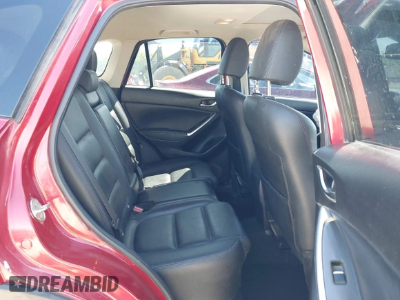 2016 Mazda CX-5 Grand Touring with VIN JM3KE2DYXG0652017, listed as a IAAI auction lot 42041158 with 95,946 mi miles and . Bid and sale history available at DreamBid. Image 8.