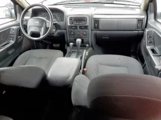 2003 Jeep Grand Cherokee Laredo with VIN 1J4GW48SX3C569087, listed as a Copart auction lot 55941035 with Not provided miles and Salvage title. Bid and sale history available at DreamBid. Image 8.