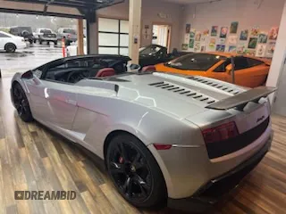 2013 Lamborghini Gallardo z VIN ZHWGU6BZ7DLA12511, wystawiony jako Copart lot #85780924 z przebiegiem 35 386 mil mil oraz Szkody całkowita. Historia ofert i sprzedaży dostępna na DreamBid. Obrazek 3.
