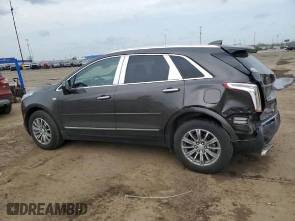 2019 Cadillac XT5 Luxury FWD with VIN 1GYKNCRSXKZ132871, listed as a Copart auction lot 54879405 with 57,325 mi miles and Salvage title. Bid and sale history available at DreamBid. Image 2.
