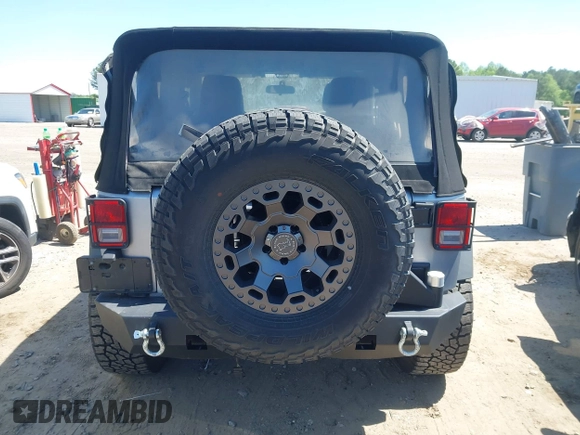 2015 Jeep Wrangler Sport with VIN 1C4AJWAG3FL696988, listed as a IAAI auction lot 41999036 with 79,064 mi miles. Bid and sale history available at carsss.com. Image 16.
