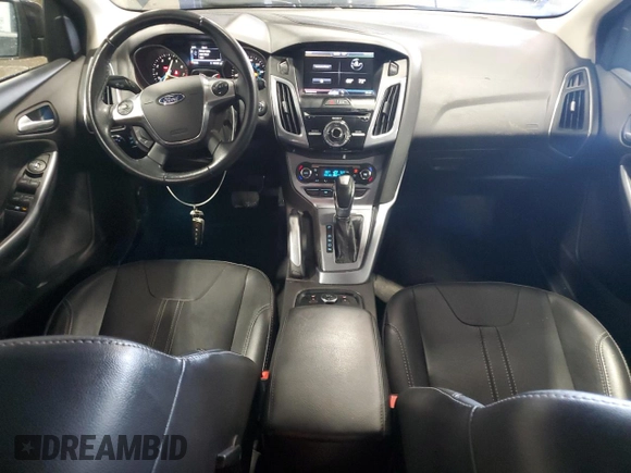 2014 Ford Focus Titanium with VIN 1FADP3N2XEL131392, listed as a Copart auction lot 61665025 with 105,597 mi miles and Salvage title. Bid and sale history available at DreamBid. Image 8.