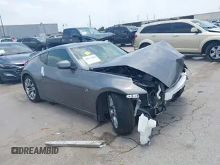 2014 Nissan 370Z with VIN JN1AZ4EH5EM634701, listed as a IAAI auction lot 39571838 with 143,556 mi miles. Bid and sale history available at carsss.com. Image 1.