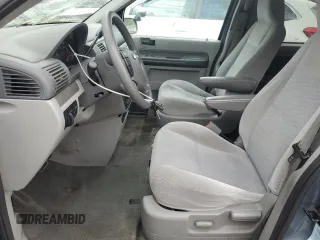 2005 Ford Freestar SE z VIN 2FMDA51605BA50204, wystawiony jako Copart lot #56002955 z przebiegiem 212 942 mil mil oraz Szkody całkowita. Historia ofert i sprzedaży dostępna na DreamBid. Obrazek 7.