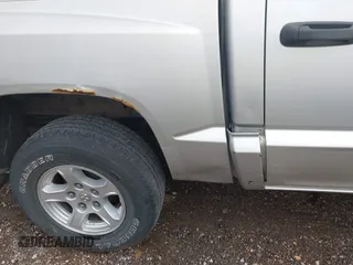 2005 Dodge Dakota SLT with VIN 1D7HE48K25S232893, listed as a IAAI auction lot 41932773 with 209,459 mi miles and . Bid and sale history available at DreamBid. Image 6.