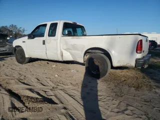 2003 Ford F-250 XL with VIN 1FTNX20L73EC70163, listed as a Copart auction lot 77061204 with 387,321 mi miles and Salvage title. Bid and sale history available at DreamBid. Image 2.