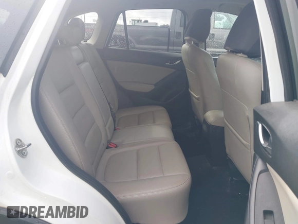 2015 Mazda CX-5 Grand Touring with VIN JM3KE4DY0F0483037, listed as a IAAI auction lot 41578222 with 102,988 mi miles. Bid and sale history available at carsss.com. Image 8.