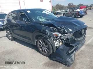 2019 Mazda CX-5 Grand Touring with VIN JM3KFADMXK1547727, listed as a IAAI auction lot 42138071 with Not provided miles and . Bid and sale history available at DreamBid. Image 1.