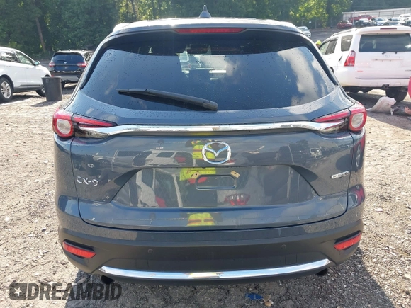 2021 Mazda CX-9 Grand Touring with VIN JM3TCADY7M0528223, listed as a IAAI auction lot 42395861 with 57,767 mi miles and . Bid and sale history available at DreamBid. Image 16.