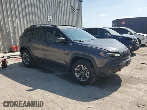 2019 Jeep Cherokee Trailhawk with VIN 1C4PJMBX0KD361639, listed as a Copart auction lot 60549865 with 95,888 mi miles and Salvage title. Bid and sale history available at DreamBid. Image 4.