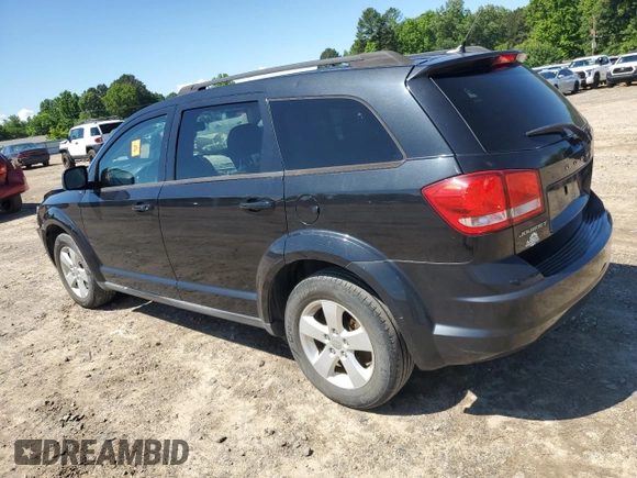 2013 Dodge Journey SE with VIN 3C4PDCAB5DT729415, listed as a Copart auction lot 55851915 with 128,782 mi miles and Salvage title. Bid and sale history available at DreamBid. Image 2.