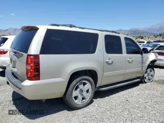 2013 Chevrolet Suburban LT with VIN 1GNSCJE06DR140058, listed as a Copart auction lot 56317995 with 124,345 mi miles and Salvage title. Bid and sale history available at DreamBid. Image 3.