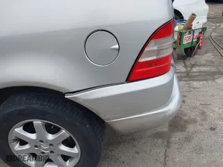 1999 Mercedes-Benz M-Class with VIN 4JGAB72E4XA113675, listed as a IAAI auction lot 41554604 with 230,092 mi miles. Bid and sale history available at carsss.com. Image 18.