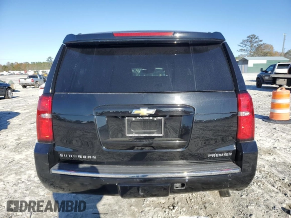 2019 Chevrolet Suburban Premier with VIN 1GNSKJKJXKR323704, listed as a Copart auction lot 72757214 with 150,404 mi miles and Salvage Title. Bid and sale history available at DreamBid. Image 6.