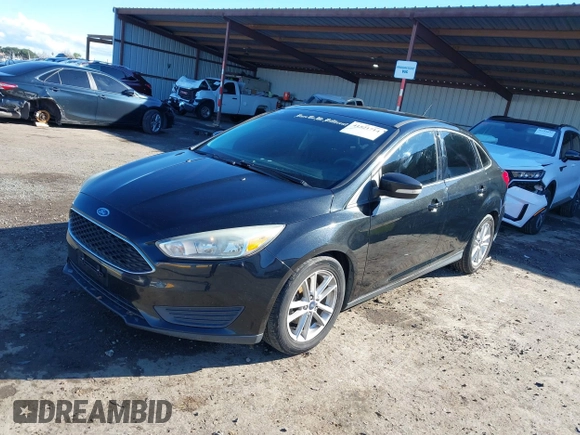 2015 Ford Focus SE with VIN 1FADP3F21FL262033, listed as a IAAI auction lot 41521714 with 101,890 mi miles. Bid and sale history available at carsss.com. Image 2.